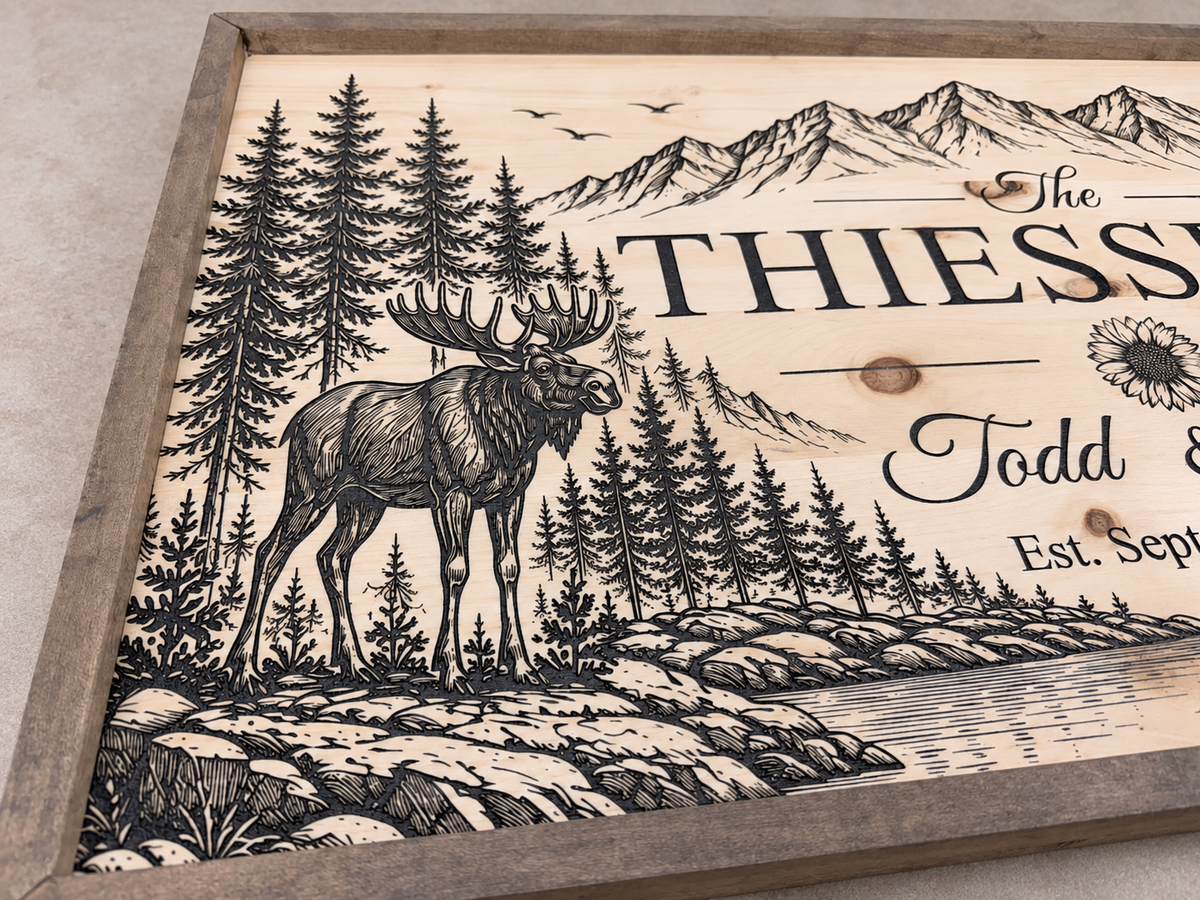 Close-up of moose engraving and wood frame