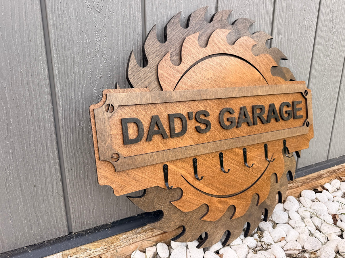 Side view of the Dad’s Garage layered sign with hooks